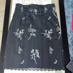 Black and white pinstriped midi pencil skirt with white floral embroidery